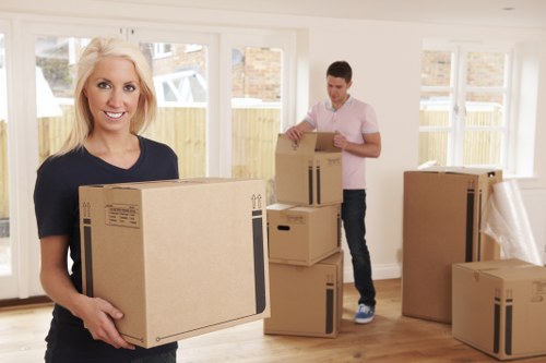 Professional removalist team assisting with moving boxes in Haringey