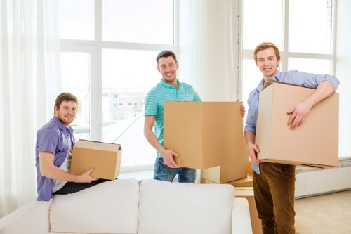 Furniture and packed boxes staged outside a home ready for loading in Haringey
