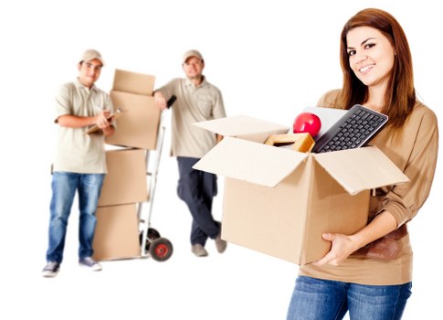 Trained movers carrying a large item safely