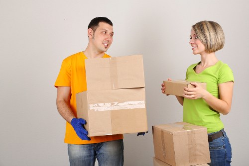 Removalists carefully handling furniture during a move in Haringey